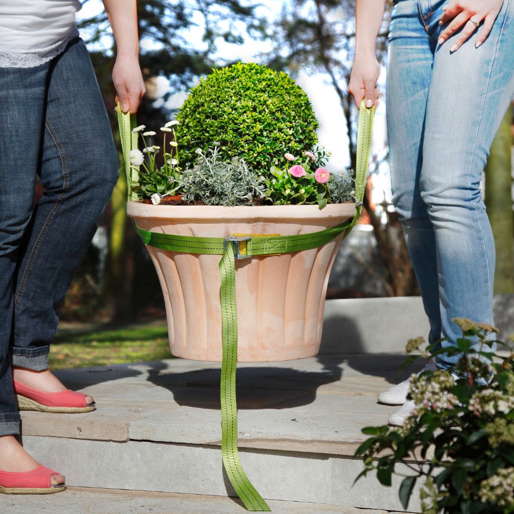 Gardening Naturally pot lifter moving a terracotta planter