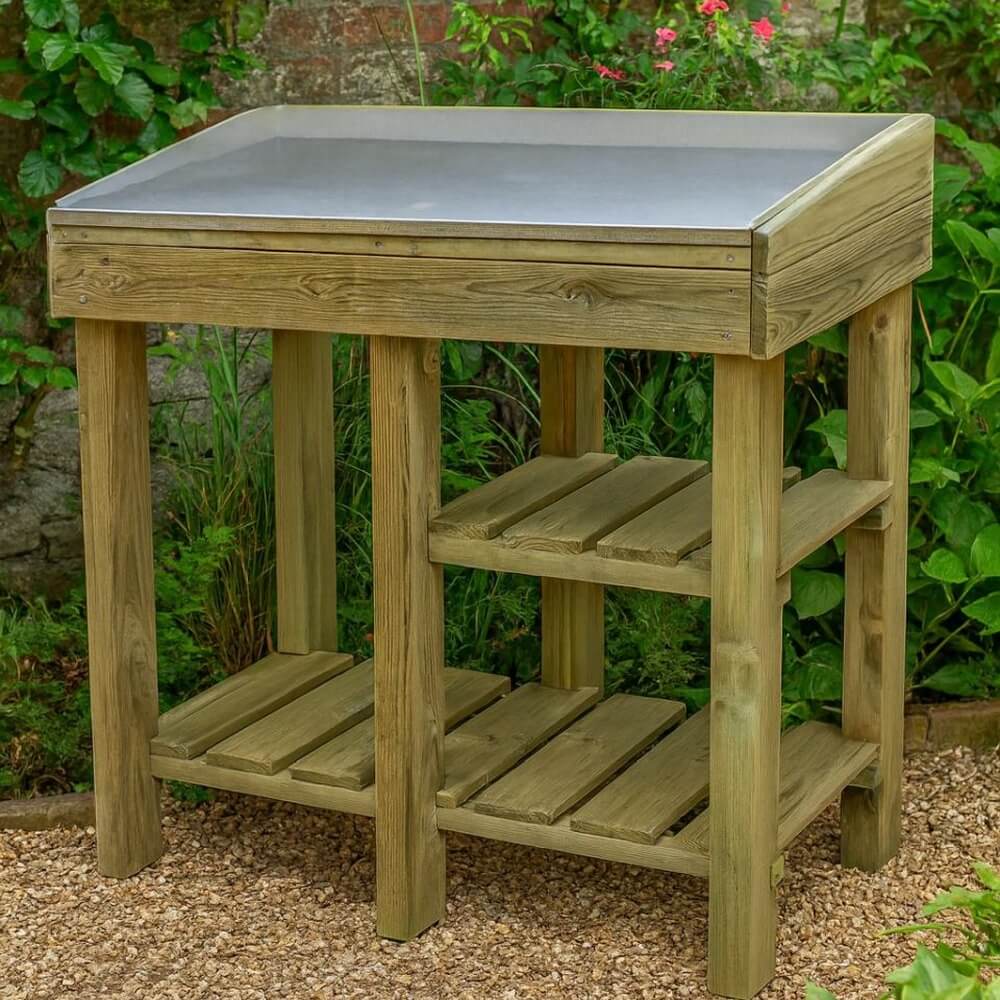 Wooden outdoor table with a metal top in a garden setting