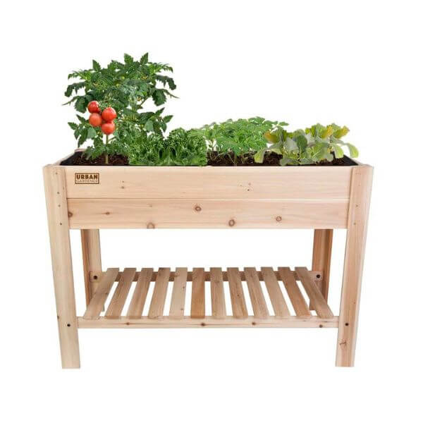 raised cedar garden planter with vegetables growing