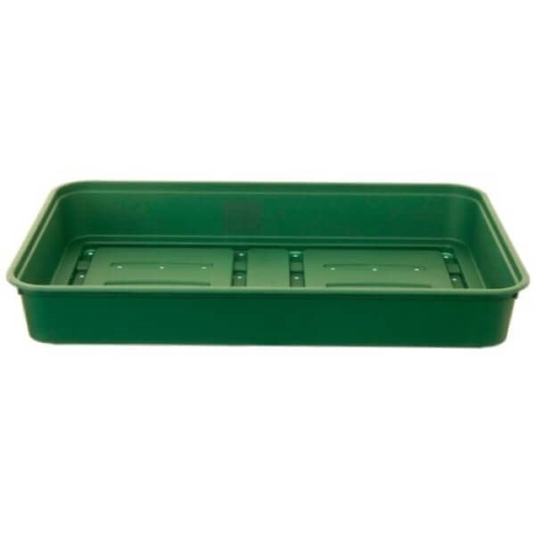 A green plastic seed tray with drainage holes designed for gardening.