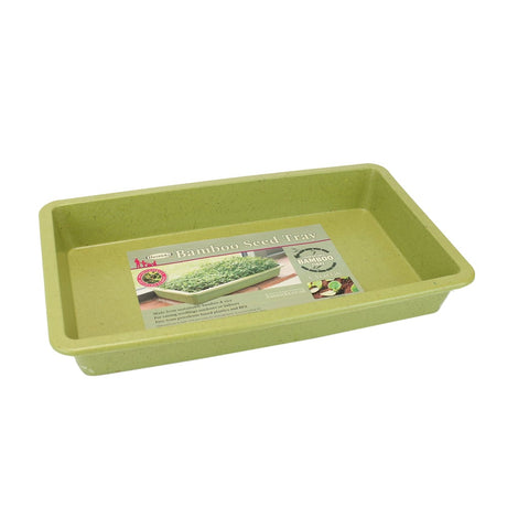 A sage green bamboo seed tray with a label at the bottom.
