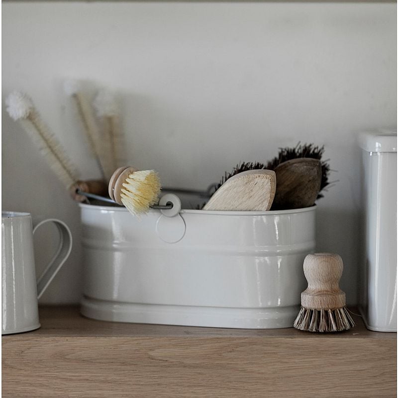 Metal bucket with handle with brushes in it