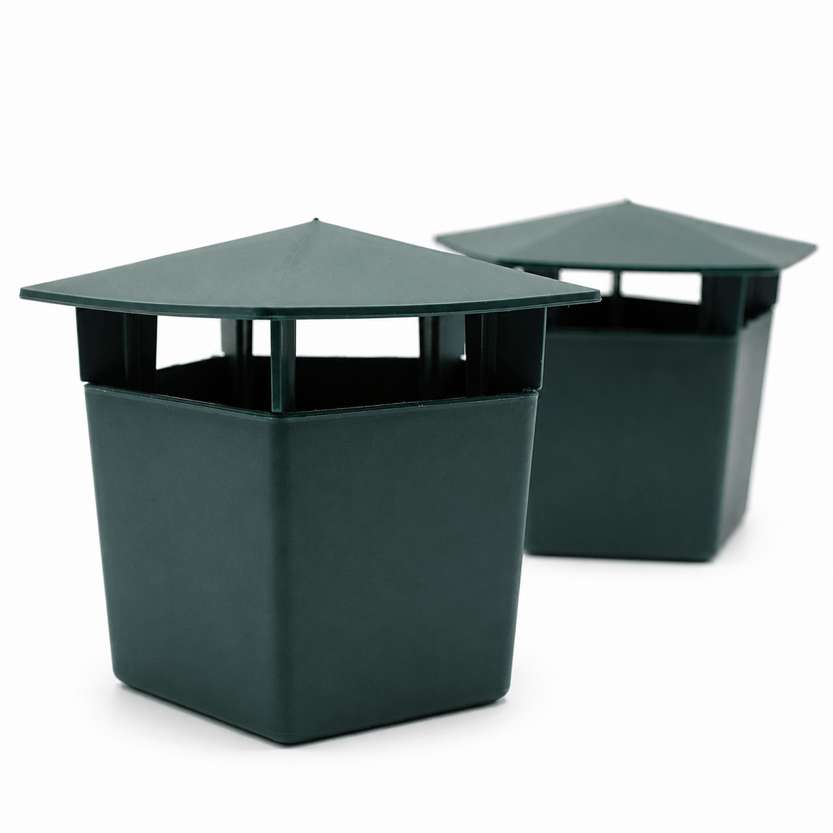 Two greenslug traps with pagoda lids on a white background