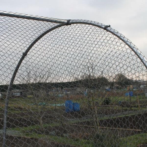 close up of netting on a small aluminium hoop frame in the garden