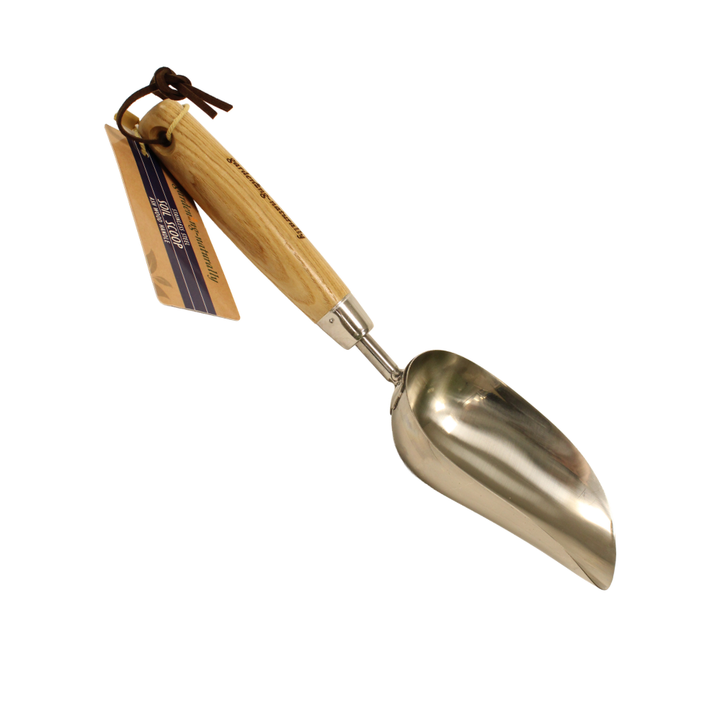 Side view of soil scoop with label on a white background