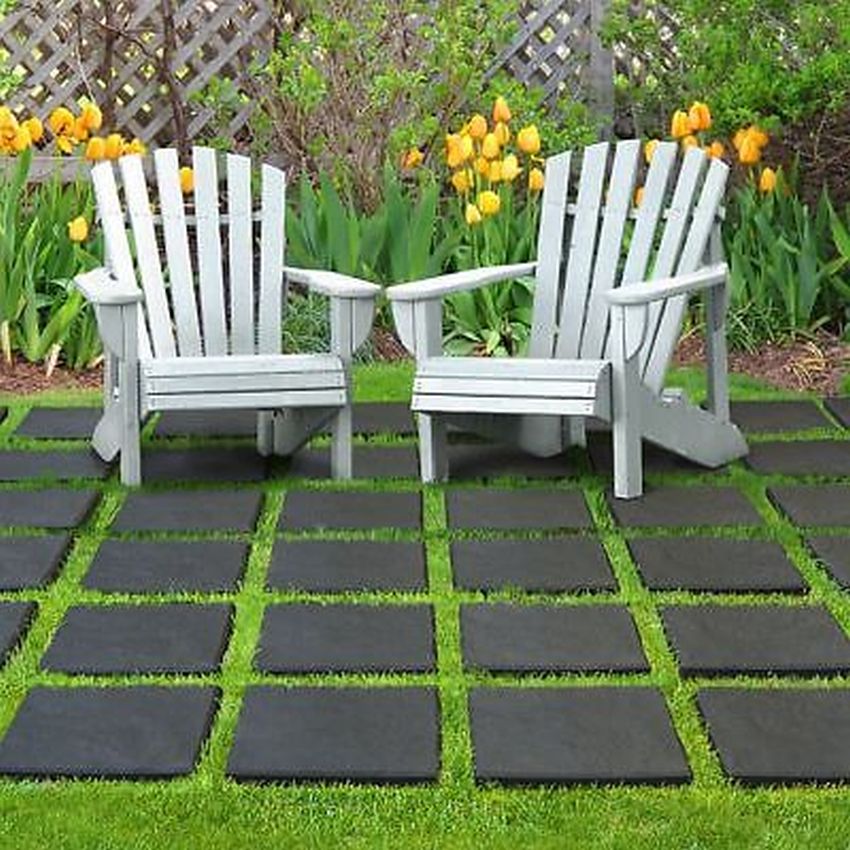 Black Stepping stones laid out with garden furniture on