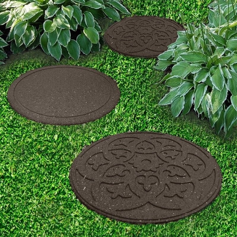 Stepping stones on lawn going between bushes