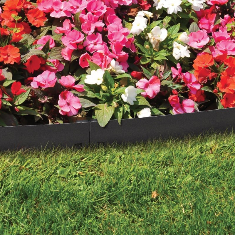 Lawn border straight edge with flowers on one side and grass on the other