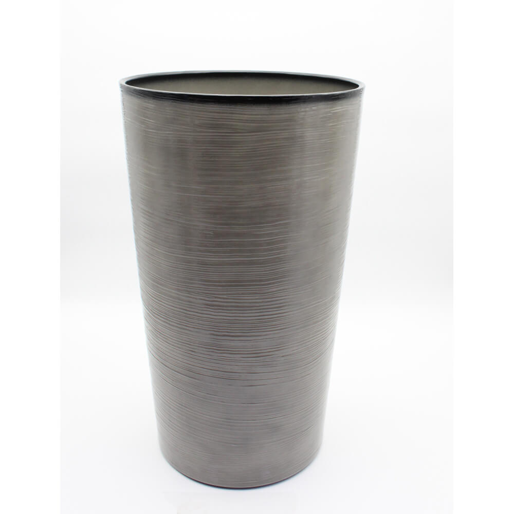 Tall gray textured vase on a white background