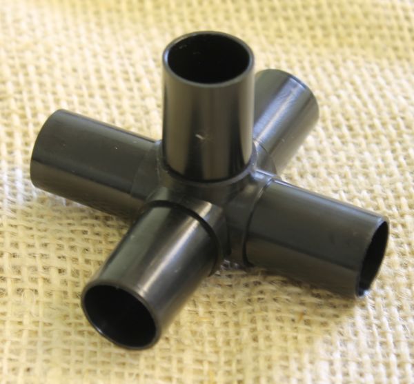 A black plastic cross joiner designed to fit 19mm aluminium poles and hoops for fruit and vegetable cages.