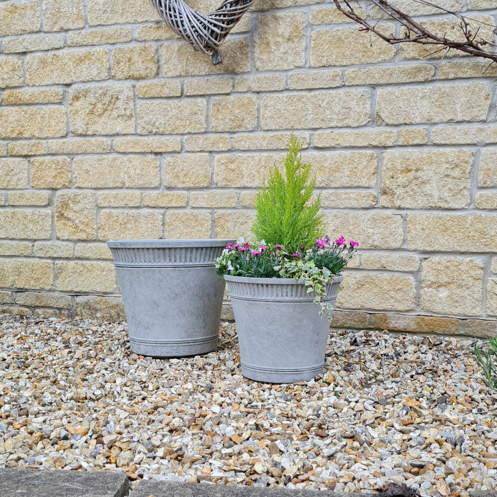 tostada grey planter in garden