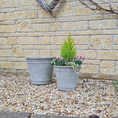 tostada grey planter in garden