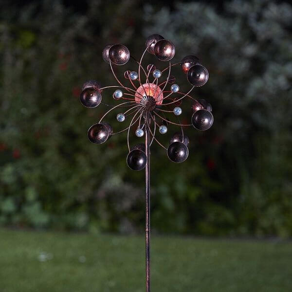 Windspinner in dark garden showing the lights