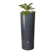 A tall, cylindrical black or grey stone water butt with a green plant on top.