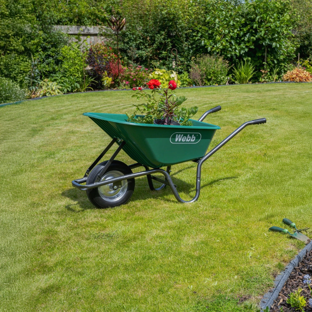 green webb wheelbarrow carrying plants