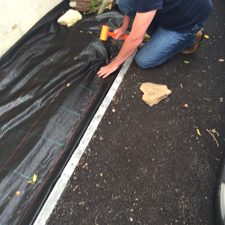 weed control fabric held down