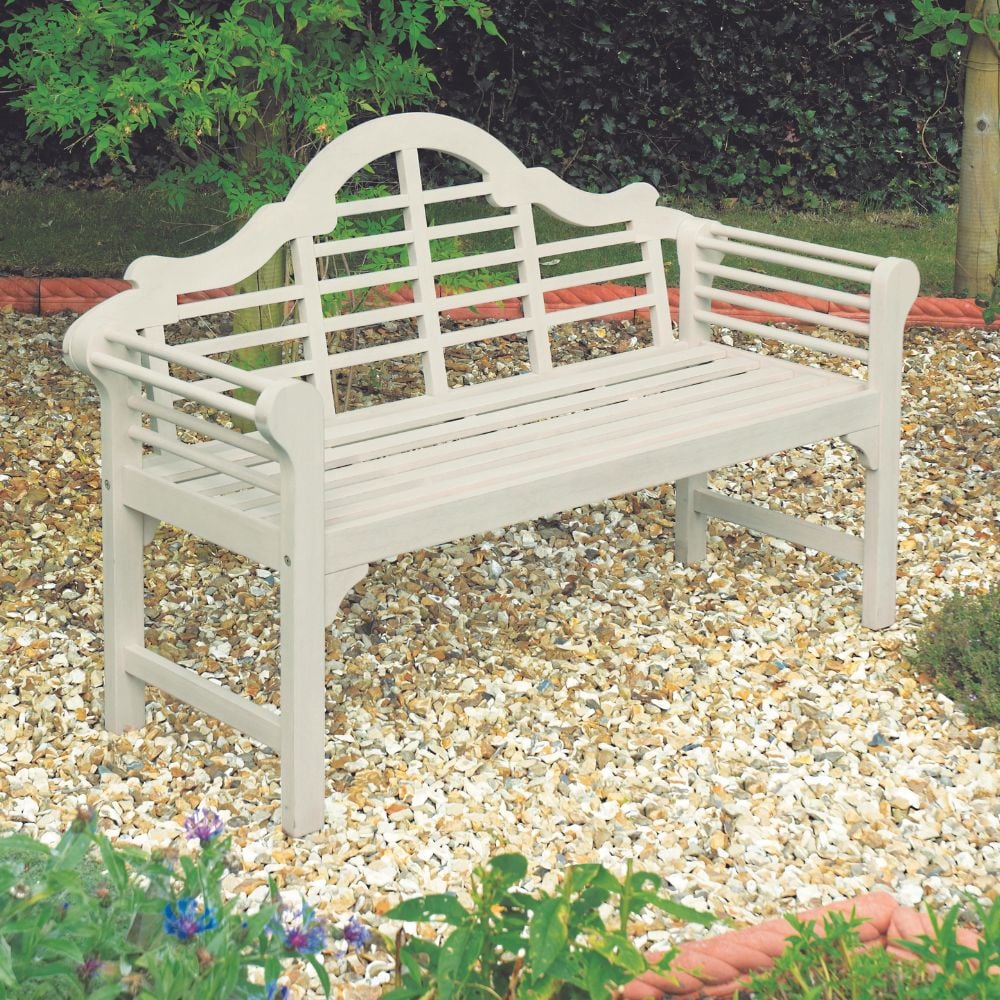 White Lutyens style garden bench on stones