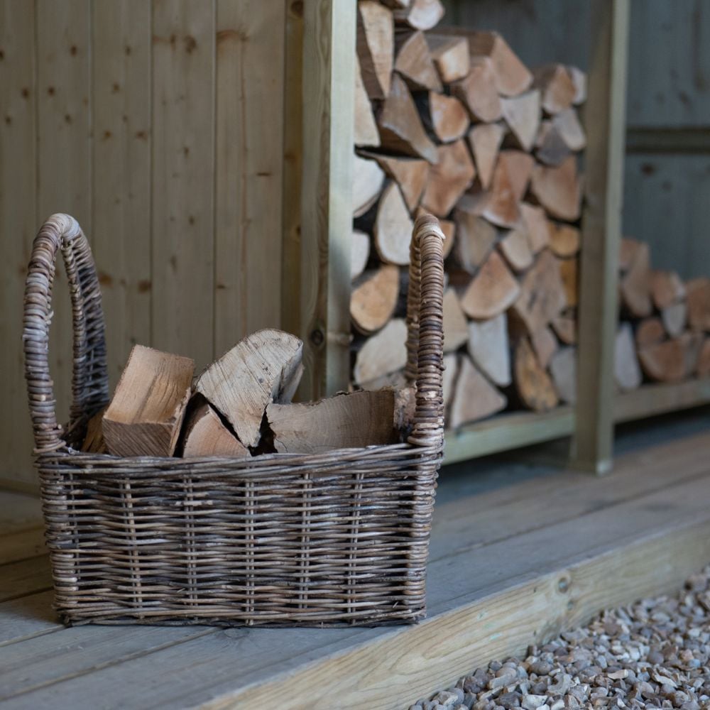 Wicker basket storing extra logs near log shed