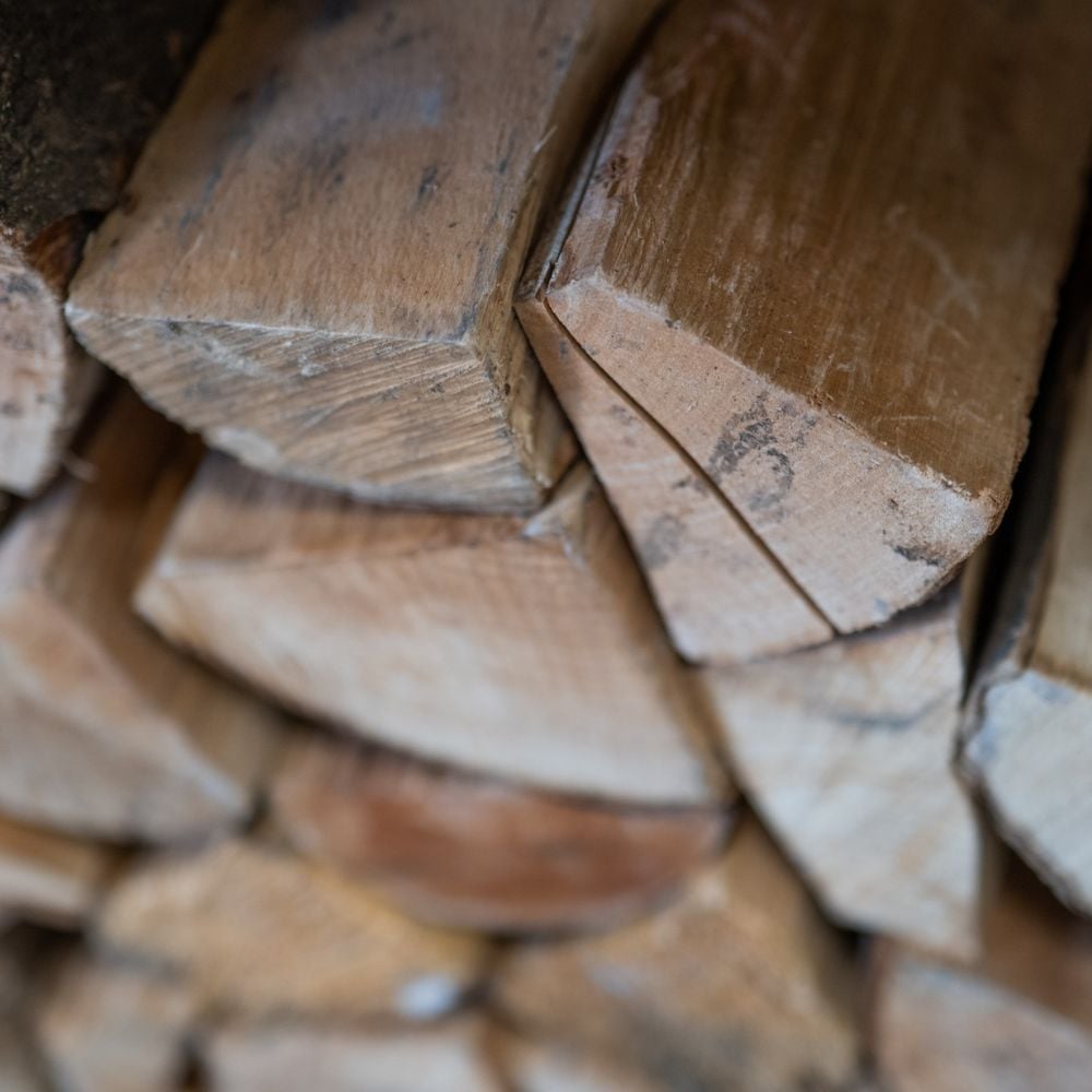 close up of wooden logs stacked