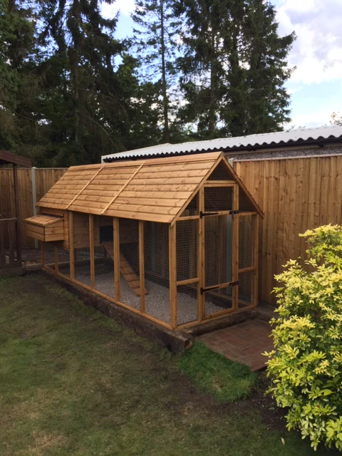 Large wooden chicken and hen coop with netted run