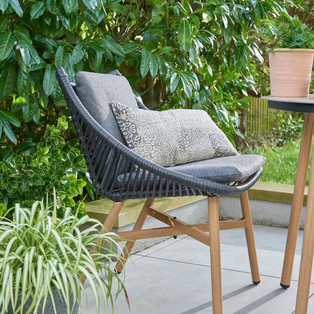 outdoor dark grey chair with cushions