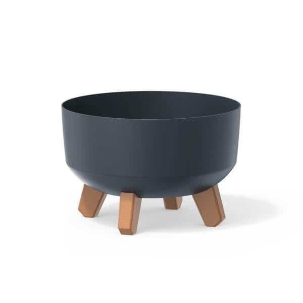 Black plant pot on wooden effect legs on white background