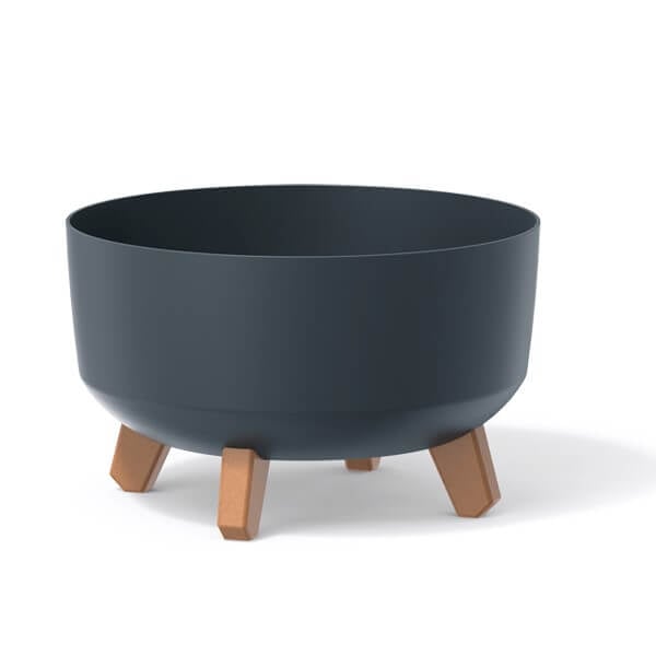 Three low plant pots with legs in white, green, and black colors, displayed against a neutral background.