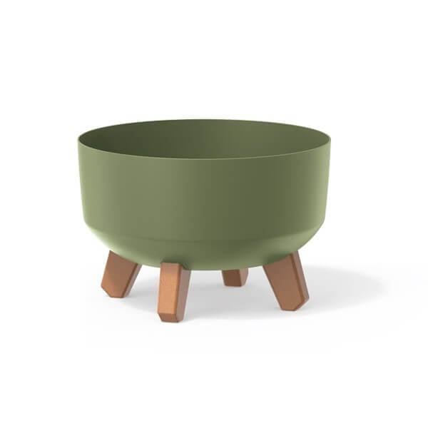 Three low plant pots with legs in white, green, and black colors, displayed against a neutral background.