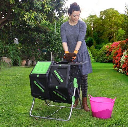 Lady using Composting Tumbler with pink bucket