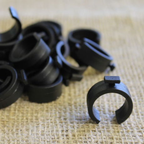 Black plastic clips designed to secure netting on 19mm hoops