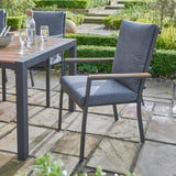 bistro set with table and 3 chairs wood and grey sat on a patio in a garden