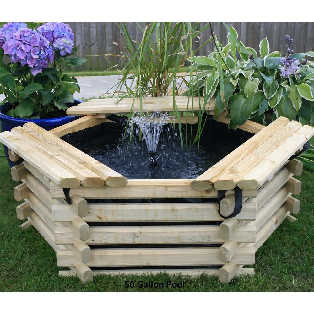 A wooden water pond surrounded by plants and a bench in a serene garden setting.