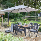 Grey Garden Table and chairs in garden with umbrella