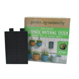 Automatic watering system being shown on a white background, with solar panel. 