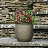 grey plant pot sat on steps
