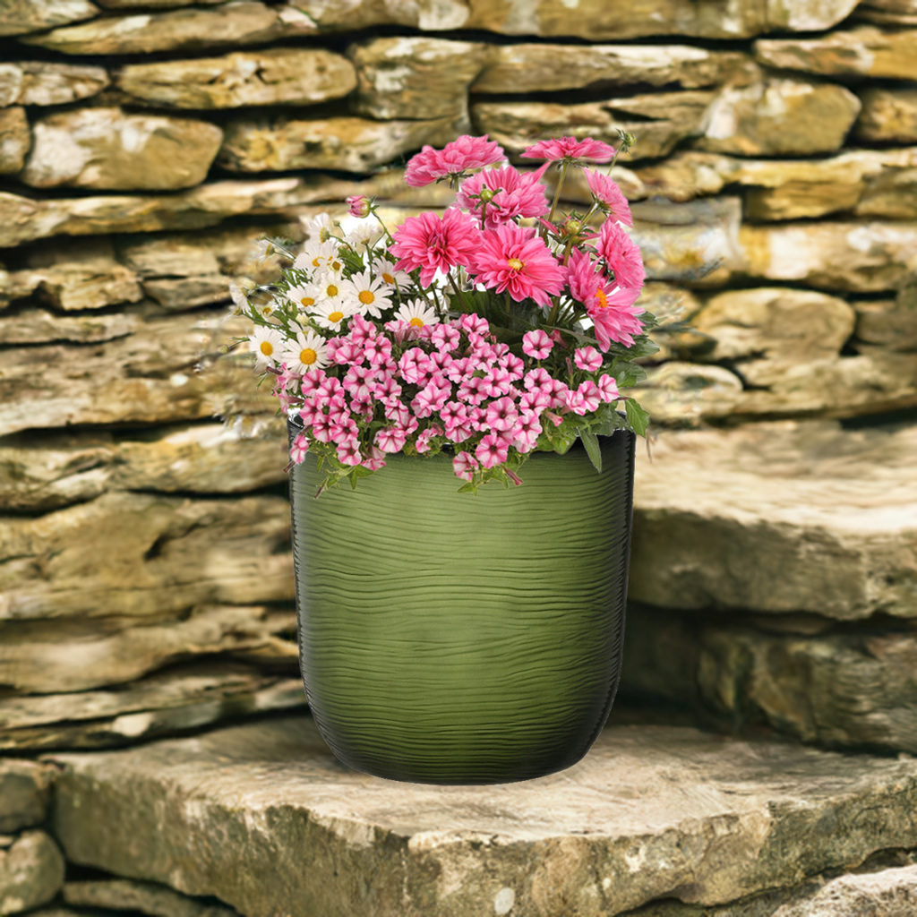 green plant pot with pink flowers