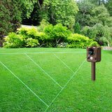 Outdoor scene with a device on grass, surrounded by greenery