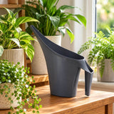 black watering can on table