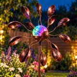 Solar wind spinner in the garden with solar light on
