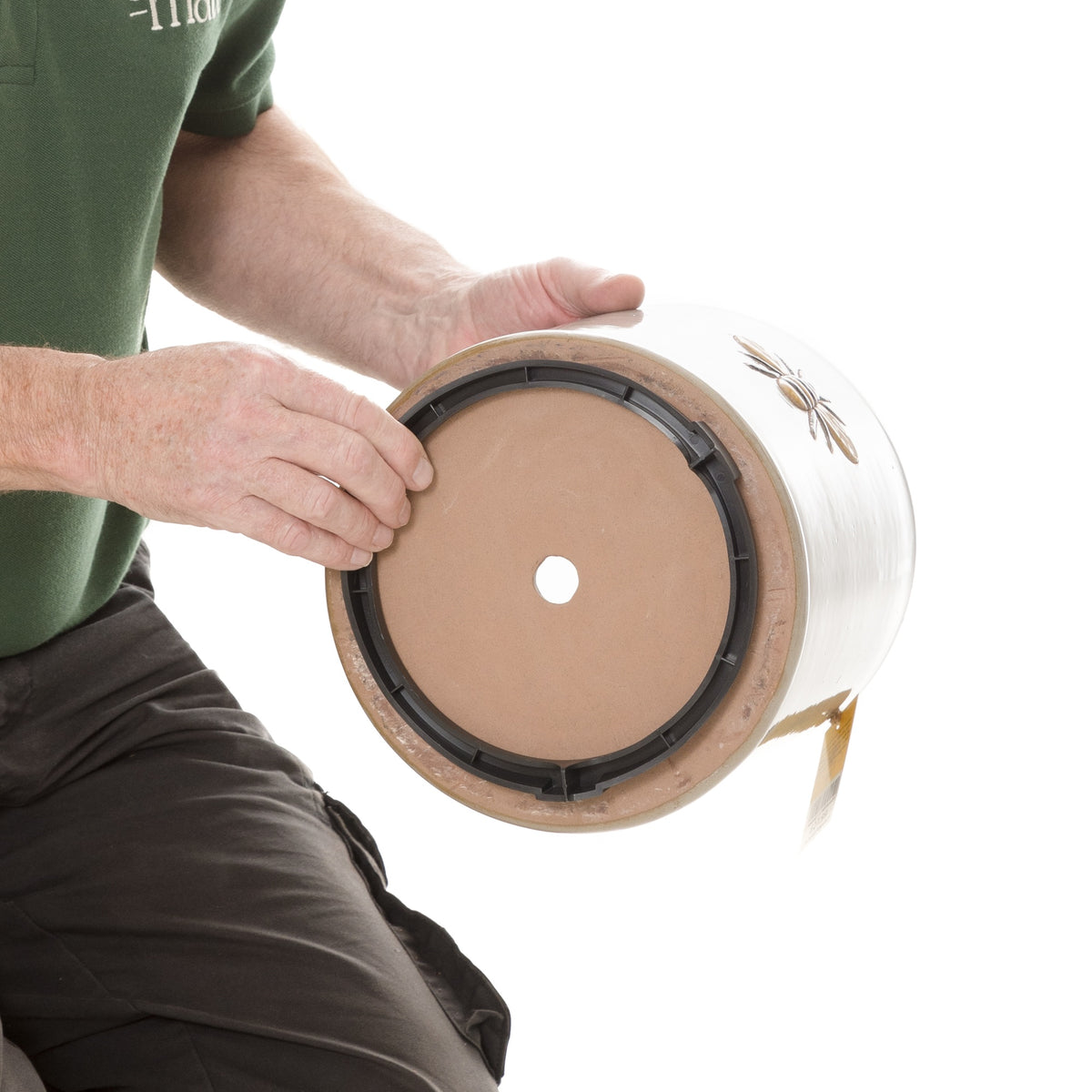 Pot mate being shown how to use on pot