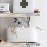 Utility bucket full of cleaning things and odds and ends