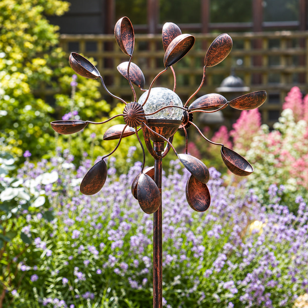 Solar wind spinner in the garden at day time
