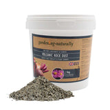 1 kg tub of volcanic rock dust soil improver with loose rock dust shown.