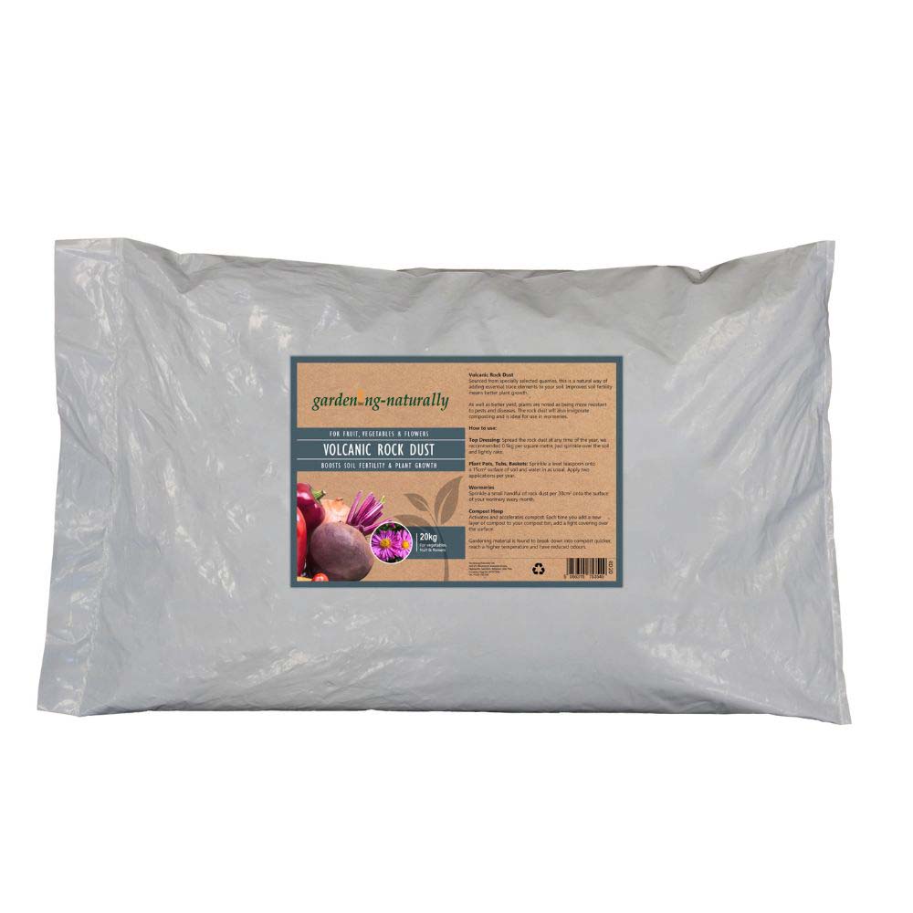 A large white plastic bag of gardening-naturally Volcanic Rock Dust, featuring a rectangular label with product details and illustrations of vegetables on a white background.