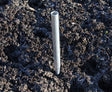 Aluminium anchor tube with a pointed end pushed into the soil