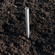 aluminium anchor for cage driven into dark soil