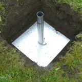 Metal pipe or drain in a dug-out square hole on grass