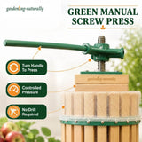 Green manual screw press for extracting juice from green vegetables, shown with feature callout overlays on a soft garden-themed background.