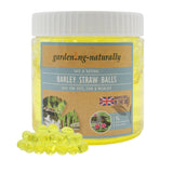 A 1L jar of Gardening naturally Barley Straw Balls for pets, fish, and wildlife, shown with several translucent yellow balls in front of the white-lidded container on a white background.
