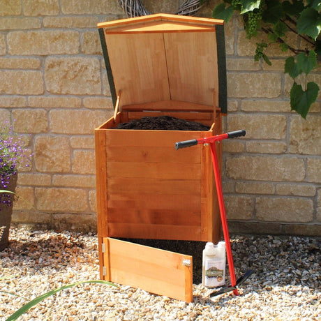 wooden beehive composter filled with compost